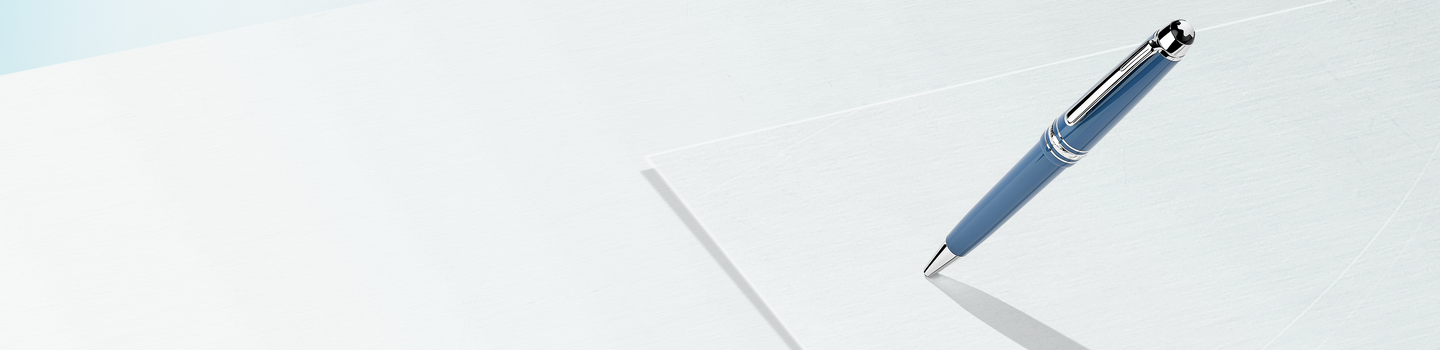 A Montblanc pen on light blue background.